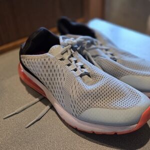 Gray and Red Athletic Shoes with Breathable Mesh and Cushioned Midsole